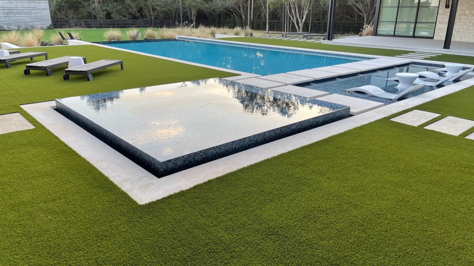 Artificial grass backyard pool area installed by SYNLawn