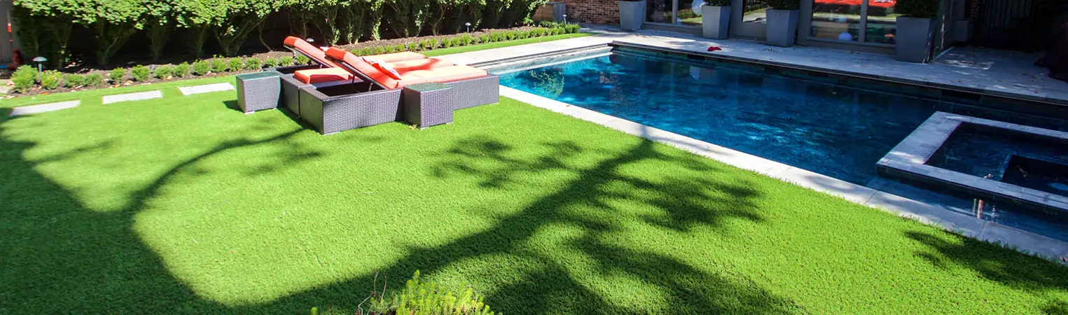 Artificial grass backyard pool area installed by SYNLawn